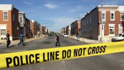 Madison Street is blocked by police due to a barricade situation on May 20, 2015 in Baltimore, Md. Children were extracted at the scene and at least one person of interest was taken into custody. (Karl Merton Ferron/Baltimore Sun/TNS via Getty Images)