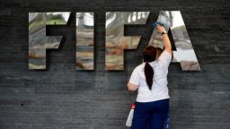 A woman cleans a FIFA sign prior to the arrival of Brazilian President Dilma Rousseff on January 23, 2013 at the football's world governing body's heaquarters in Zurich. Rousseff and FIFA President Sepp Blatter met for updates on the preparations for the 2014 FIFA World Cup in Brazil, taking place from June 12 to July 13. AFP PHOTO / FABRICE COFFRINI        (Photo credit should read FABRICE COFFRINI/AFP/Getty Images)