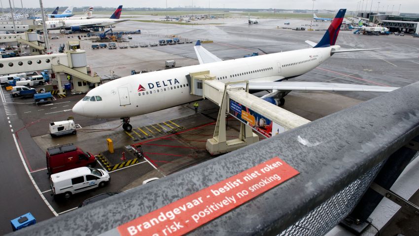 A plane of Delta Airlines with 398 people on board, on his way from Paris to Detroit, made a precautionary landing at Schiphol airport on August 7, 2013. An Airbus headed from Paris to the US with over 300 people on board landed safely at Amsterdam Schiphol airport on Wednesday after it was diverted because its flaps jammed. "The plane has landed safely at Schiphol," air traffic control spokeswoman Bertine Langelaan told AFP. Delta Airlines said earlier that its Flight 99 to Detroit had been diverted because it was unable to retract its flaps after taking off from Paris hub Charles de Gaulle. AFP PHOTO  / ANP - MARCEL ANTONISSE = netherlands out        (Photo credit should read MARCEL ANTONISSE/AFP/Getty Images)