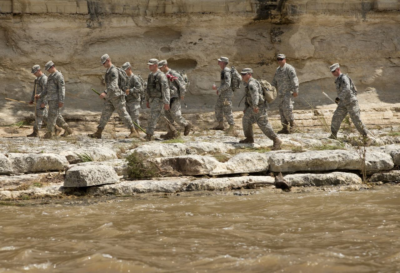 Members of the Texas National Guard search for bodies on the banks of the Blanco River after flooding in Wimberley on May 26.
