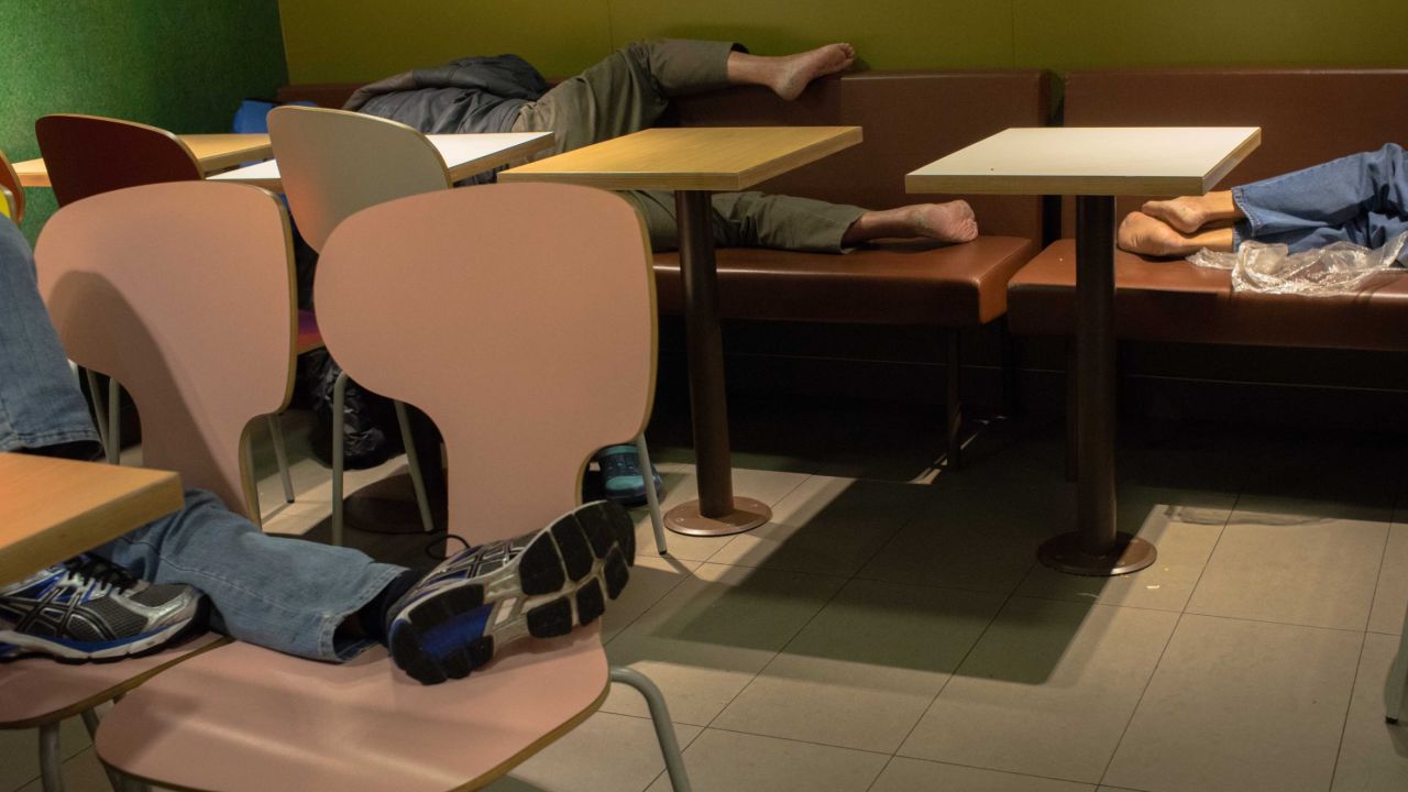 People sleep at a McDonald's in 2015.
