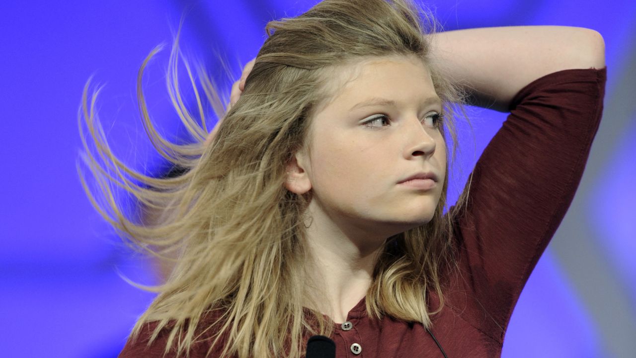 Hailey Hogenson, of Ludington, Michigan, flips her hair before spelling the word "amphibious" on May 27.