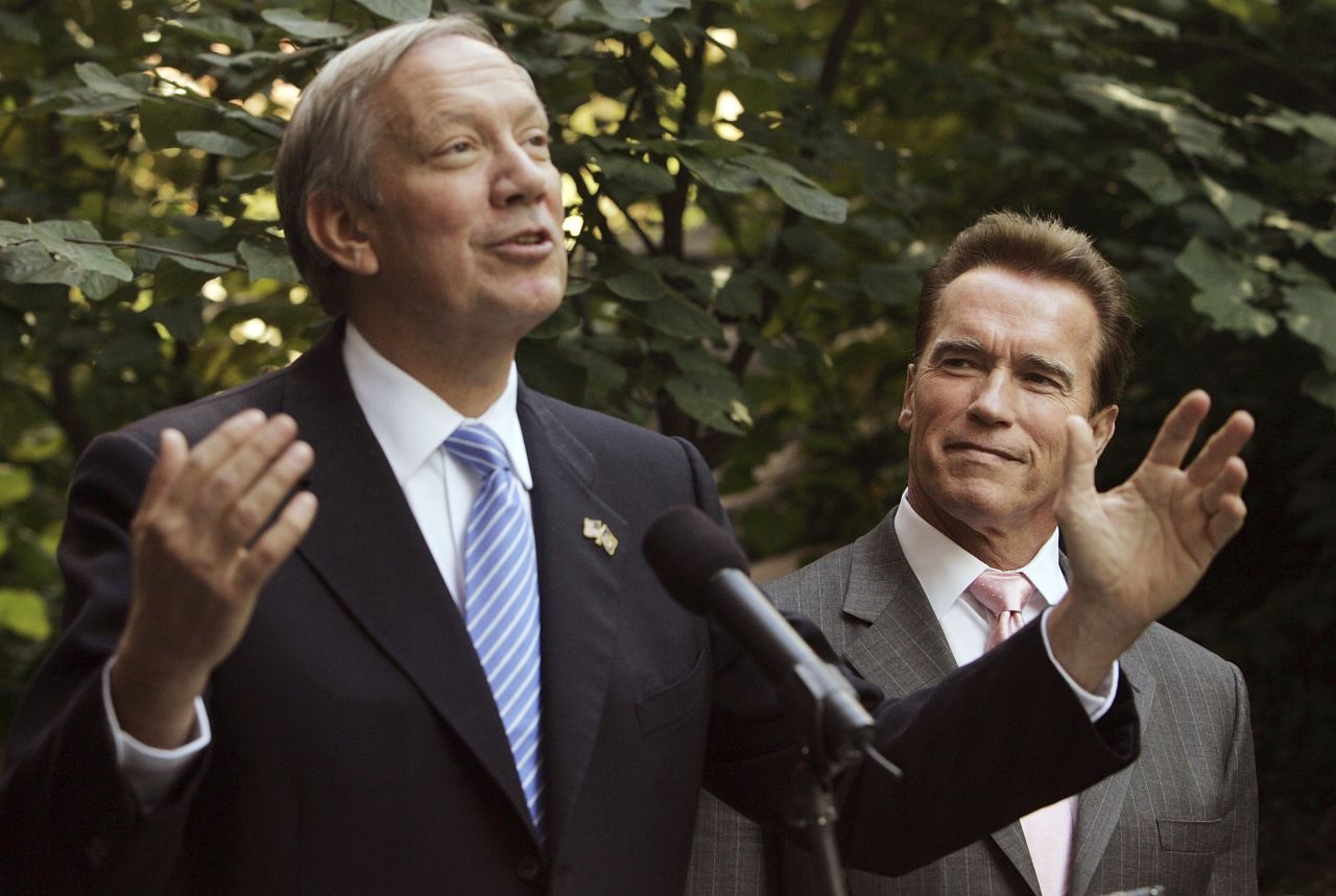 Pataki, left, and then-California Governor Arnold Schwarzenegger speak to the media in the courtyard of the Solaire Building, the largest residential green building in the nation, October 16, 2006 in New York City.