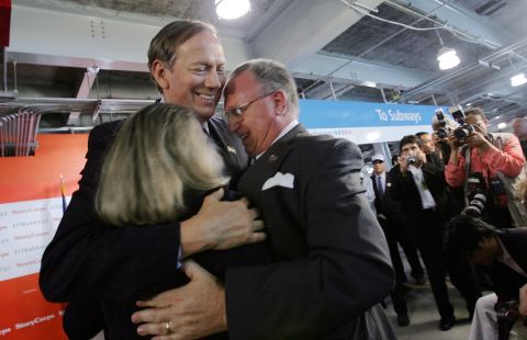 Pataki greets Alison and Jefferson Crowther, who lost their son, Welles, on September 11, during a news conference at the World Trade Center site June 16, 2005 in New York City. 