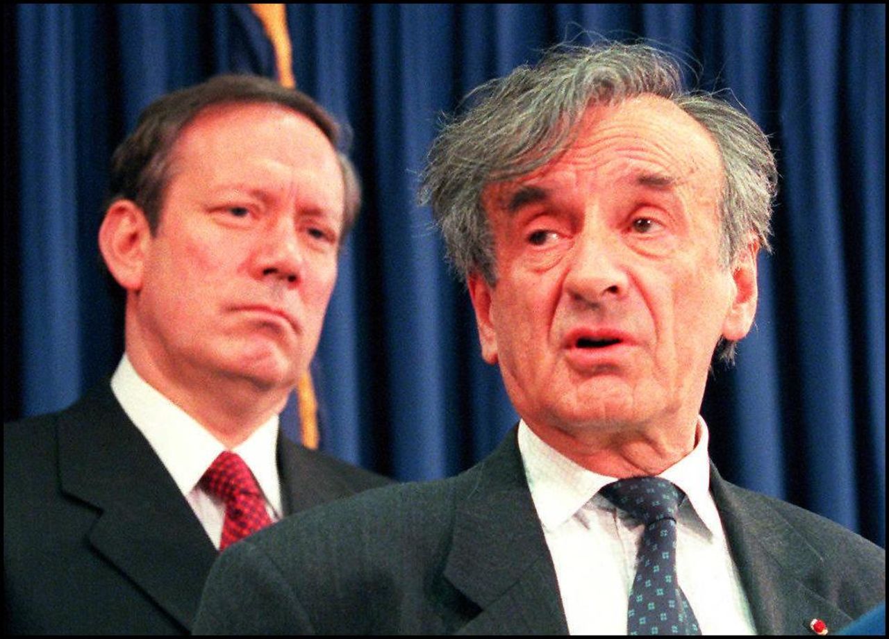 Nobel Prize winner and Holocaust survivor Elie Wiesel, right, and Pataki, left, announce February 6, 1997 that the governor is sending the state banking superintendent to Switzerland to meet with bank officials as part of a probe into actions during World War II.  