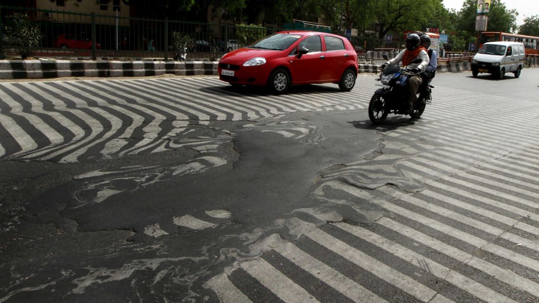 A road melts near Safdarjung Hospital in Delhi after temperatures rose to 45 C on May 24, 2015.
