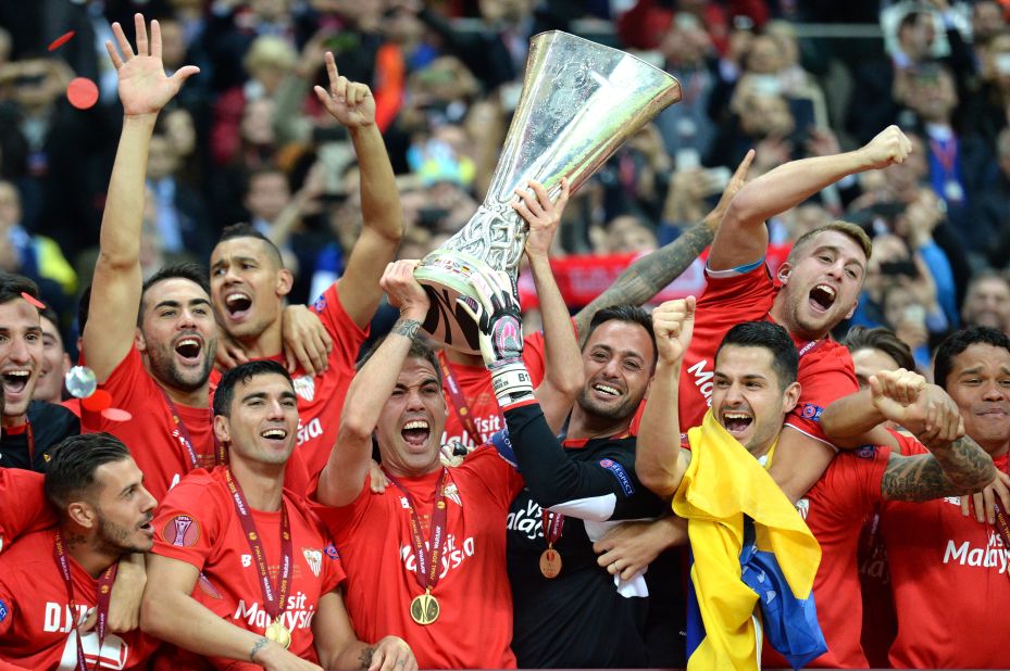 Sevilla players celebrate after a record fourth victory in UEFA's second-tier competition, beating Dnipro Dnipropetrovsk in the Europa League final in Warsaw. 