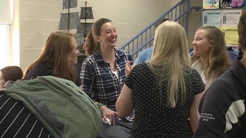 Principal Courtney Vashaw, second from left, chats with students at Profile Senior High School in New Hampshire.