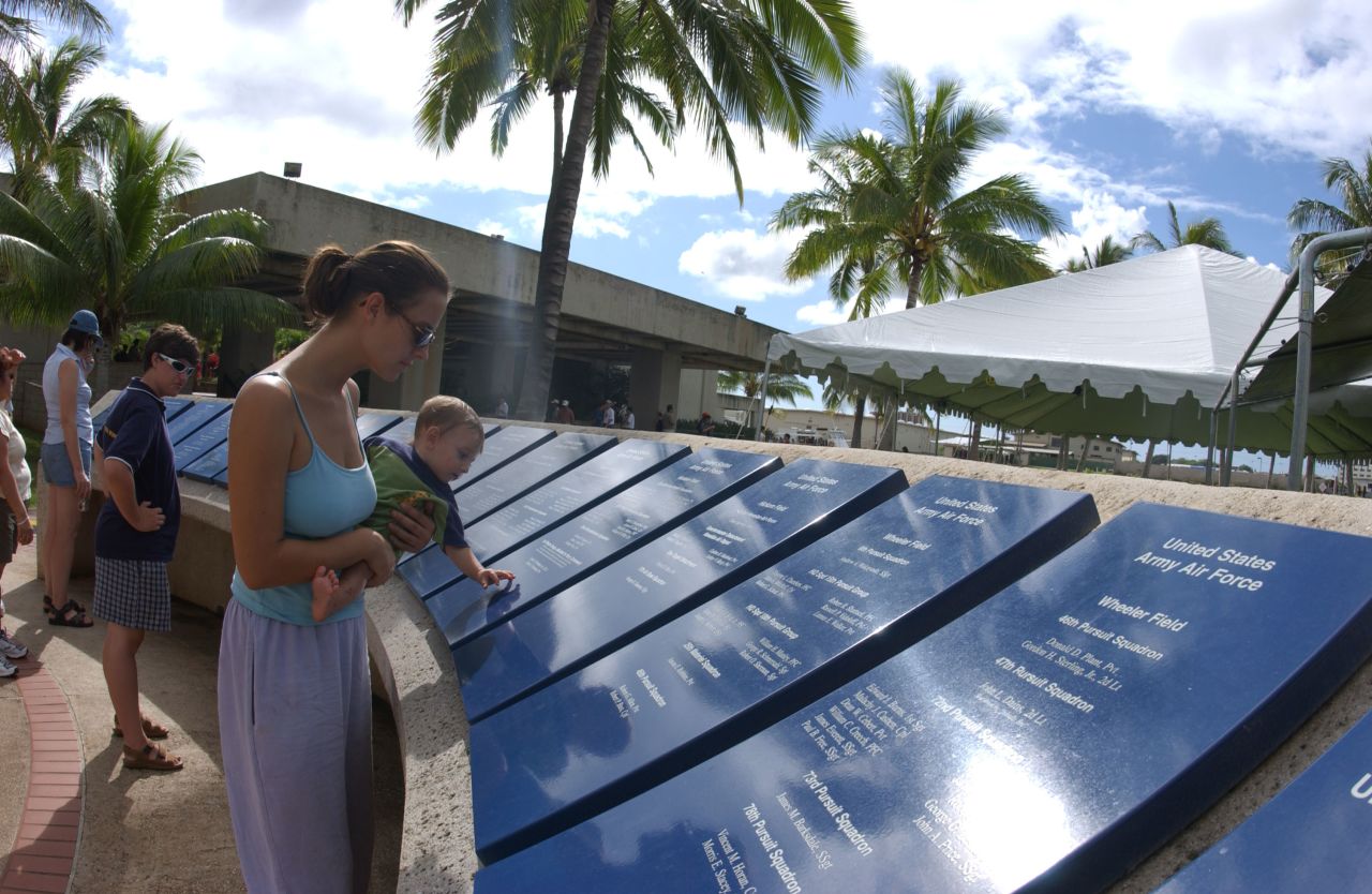 Visitors tour the grounds of the memorial's visitor center in 2003.