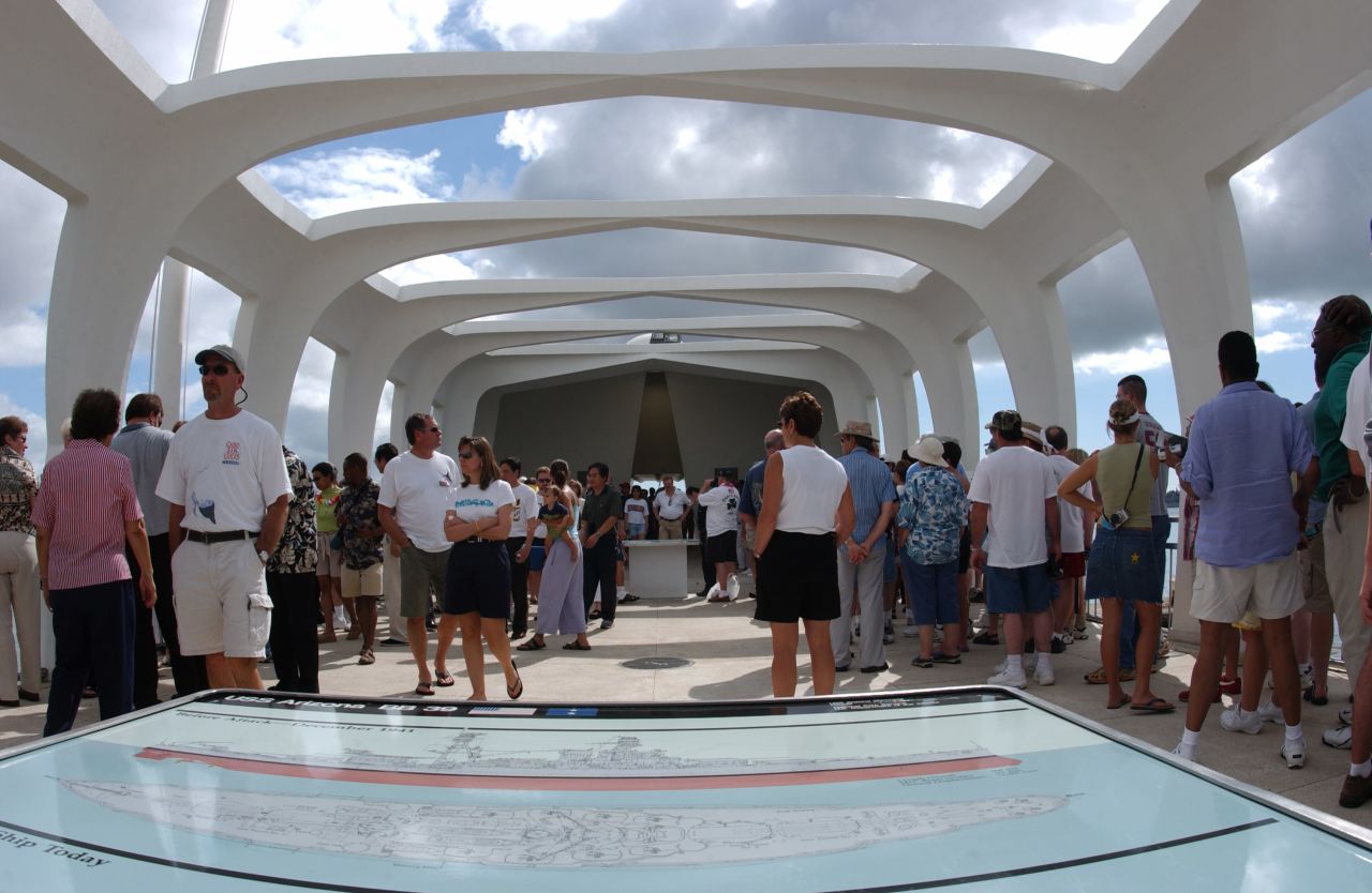 Visitors pay their respects aboard the memorial in 2003. About 5,000 people visit it every day.