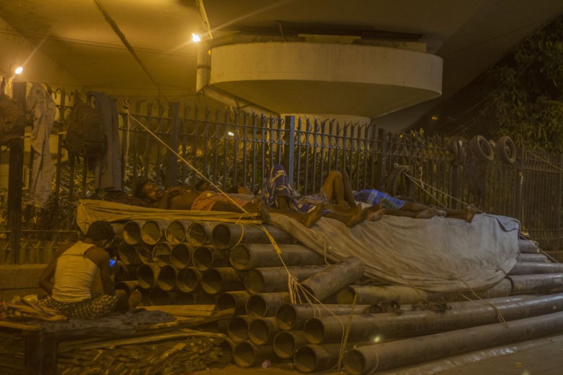 Construction workers asleep in the Delhi heat, Wednesday, May 27.