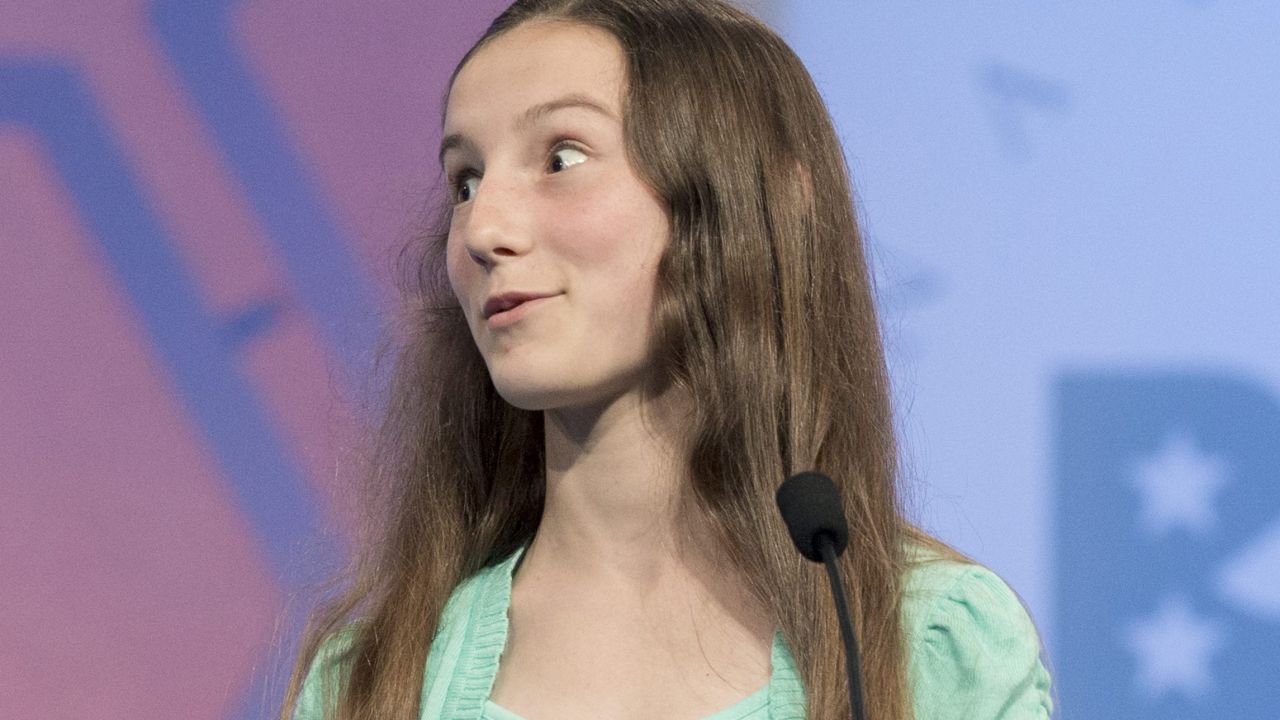 Lily Mears, of Grand Rapids, Michigan, reacts after correctly spelling "vilipend" on May 28.