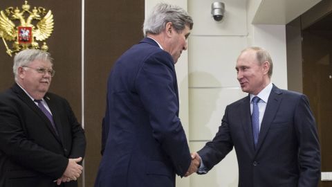 U.S. Secretary of State John Kerry shakes hands with Russia's President Vladimir Putin, next to U.S. Ambassador to Russia John Tefft at the presidential residence Bocharov Ruchey in Sochi.