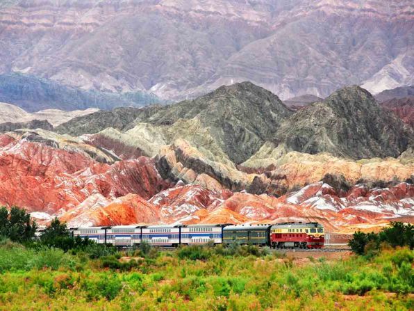 "When this train is traveling through the Gobi Desert, the scenes become boring. But the Danxia landforms ignited my passion for beauty," says Wang. "The naturally eroded mountains have mixed colors of red, yellow, gray and white. This photo was taken when my dad and I drove after the trains from Akzo to Kashi." 