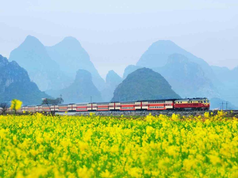 "In July, Inner Mongolia's Aer Mountain has canola flower blossoms," says Wang. "I got up at 4 a.m. and the place was in thick mist. It's not easy to catch a train photo in the mist, but it looked just like a wonderland. Fortunately, the train was moving real slow so I had plenty of time to catch a good moment."