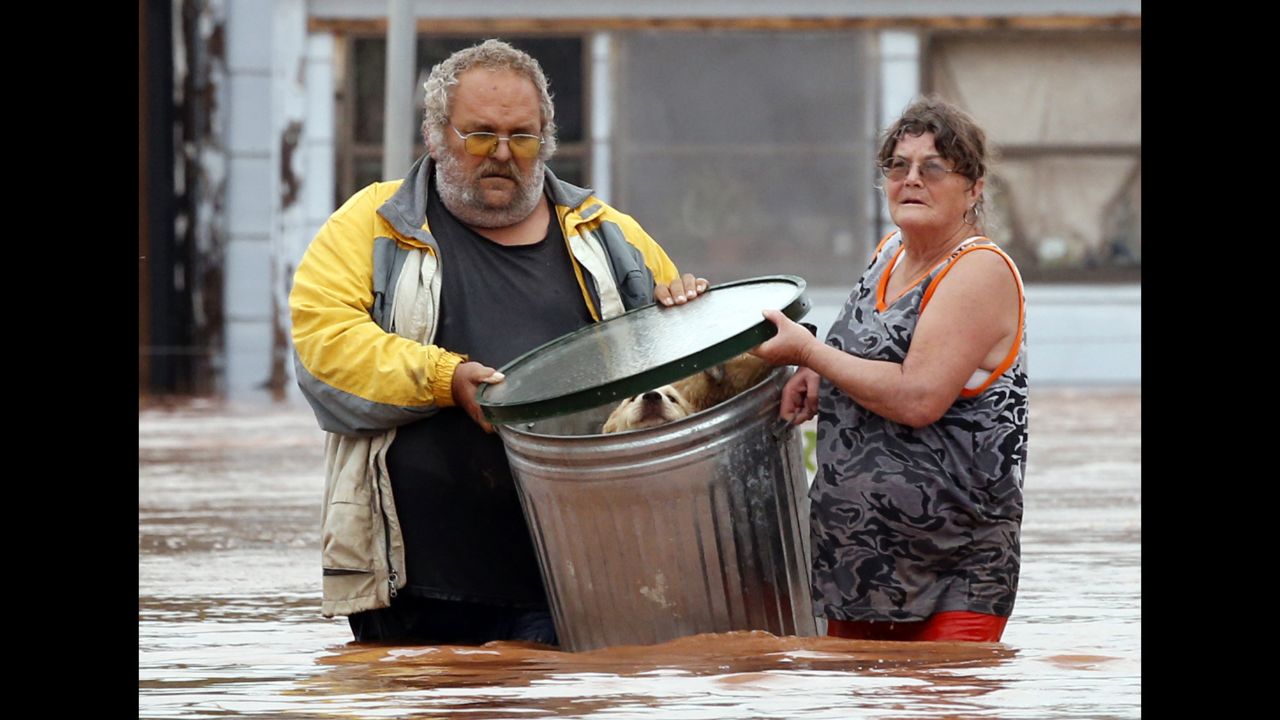 George and Susan Kruger take some of their animals to safety after the family's home in Purcell, Oklahoma, was flooded on Sunday, May 24.<a href="http://www.cnn.com/2015/05/24/us/gallery/texas-oklahoma-flash-flood/index.html" target="_blank"> Record-setting rains and dangerous storms</a> have been battering Oklahoma and Texas since Memorial Day weekend.