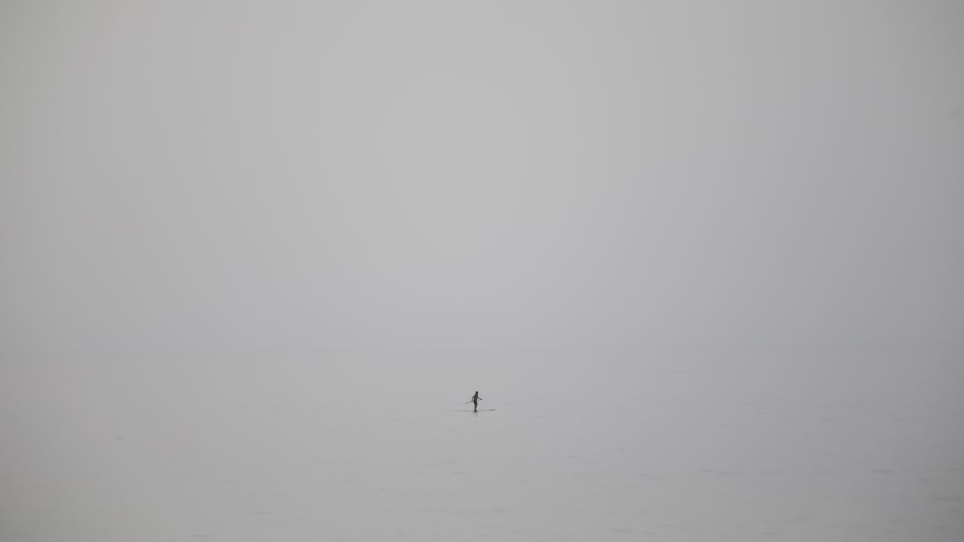 A man stands on his paddleboard Wednesday, May 27, in the Mediterranean Sea near Tel Aviv, Israel.