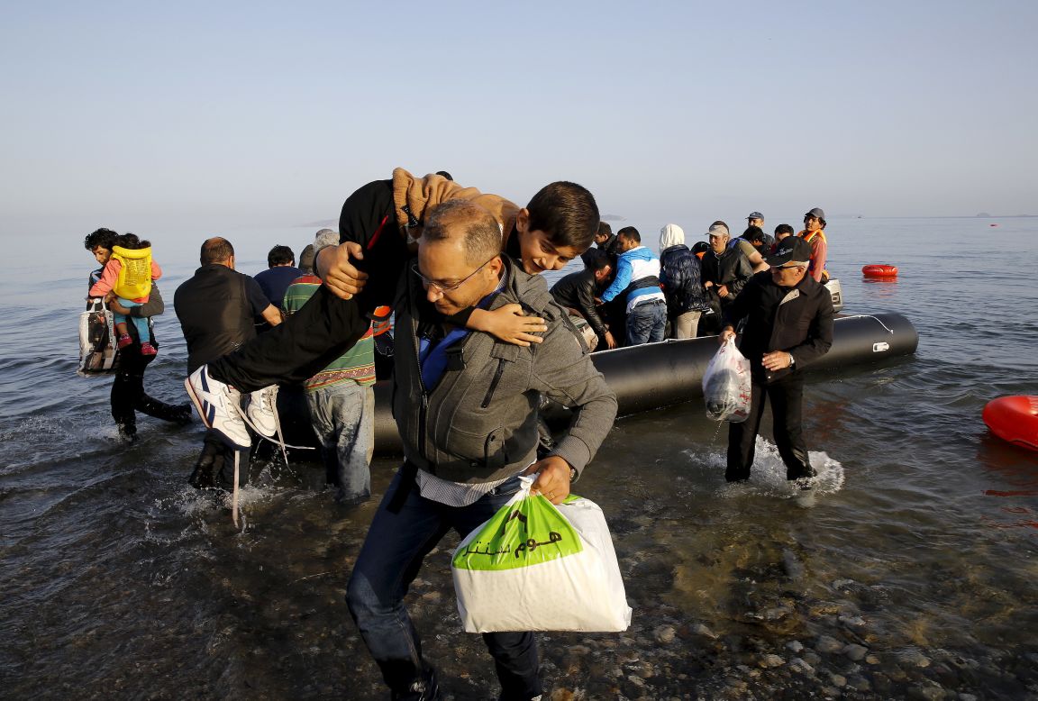 Syrian refugees on an overcrowded dinghy land on the Greek island of Kos on Tuesday, May 26. More than 220,000 people have been killed in Syria since an uprising in March 2011 <a href="http://www.cnn.com/2015/05/22/world/gallery/syria-civil-war-pictures/index.html" target="_blank">spiraled into civil war.</a>