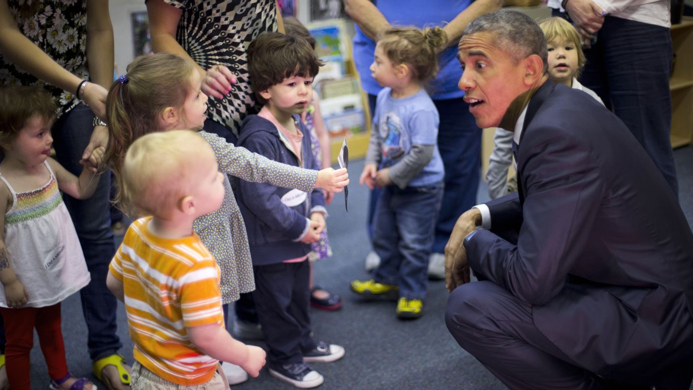 U.S. President Barack Obama talks with children during a visit to a preschool in Washington on Friday, May 22.