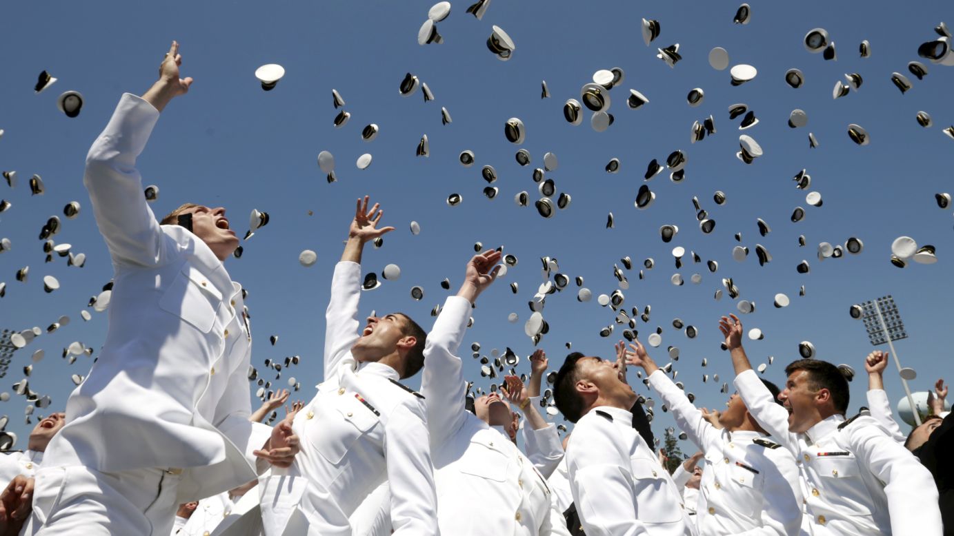 Graduates of the U.S. Naval Academy toss their caps in the air at the end of their commencement ceremony Friday, May 22, in Annapolis, Maryland.