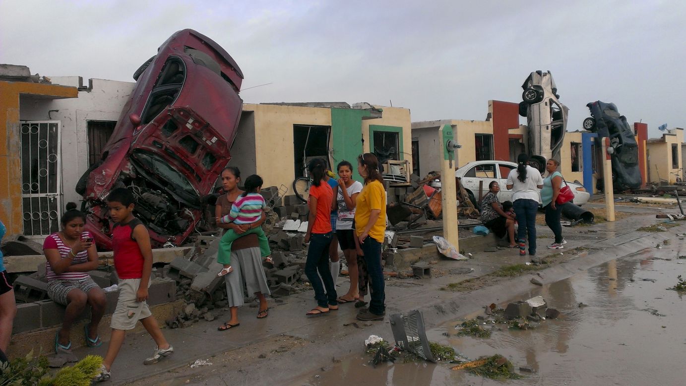 Overturned cars lean against homes after <a href="http://www.cnn.com/2015/05/25/world/gallery/tornado-mexico/index.html" target="_blank">a tornado hit Ciudad Acuna, Mexico,</a> on Monday, May 25. At least 13 people were killed, authorities said.