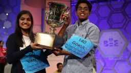 Caption:NATIONAL HARBOR, MD - MAY 28 Speller Vanya Shivashankar (L) of Olathe, Kansas, and speller Gokul Venkatachalam (R) of St. Louis, Missouri, hold up the trophy after winning the 2015 Scripps National Spelling Bee May 28, 2015 in National Harbor, Maryland. Shivashankar and Venkatachalam were declared co-champion at the annual spelling competition. (Photo by Alex Wong/Getty Images)