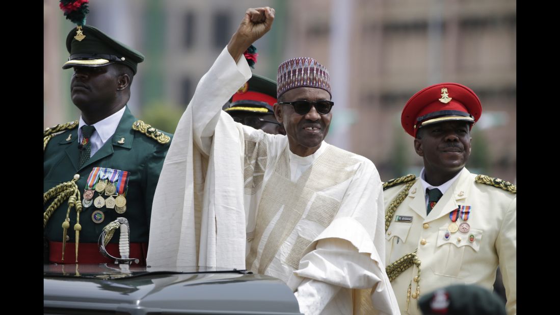 New Nigerian President Muhammadu Buhari salutes supporters during his inauguration in Abuja, Nigeria, on Friday, May 29. The ceremony marked <a href="http://www.cnn.com/2015/05/29/africa/nigeria-buhari-sworn-in/" target="_blank">the first peaceful transfer of power between rival parties</a> in the African nation. 