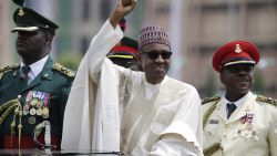 New Nigerian President Muhammadu Buhari salutes his supporters during his Inauguration in Abuja, Nigeria, on Friday, May 29.