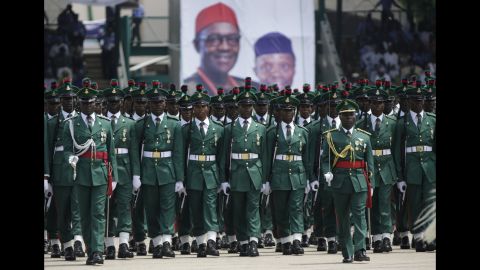 Nigerian soldiers parade during the inauguration ceremony.
