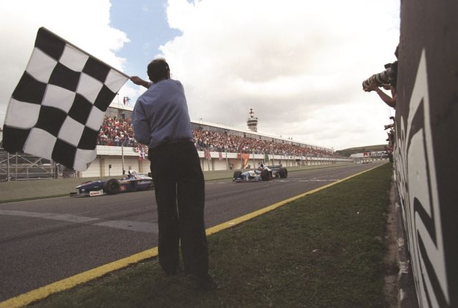 26 Oct 1997: Williams-Renault driver, Jacques Villeneuve of Canada takes the checkered flag during the European Grand Prix in Jerez, Spain. Villeneuve finished third in the race to take the F1 drivers' title.