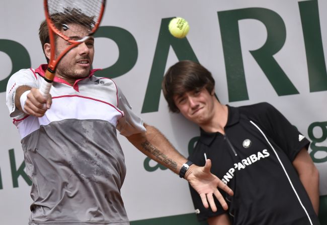 Stan Wawrinka, the 2014 Australian Open champion, sits in Federer's half of the draw. He owns a stunning one-handed backhand, which a ball kid saw up close. 