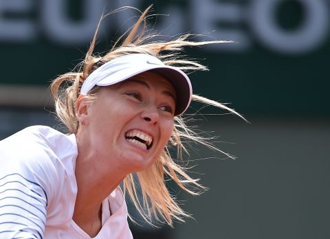 Defending champion Maria Sharapova reached the fourth round at the French Open by beating former finalist Sam Stosur in straight sets. 