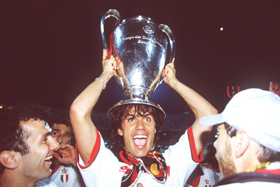 AC Milan's Paolo Maldini holds the European Cup aloft.
