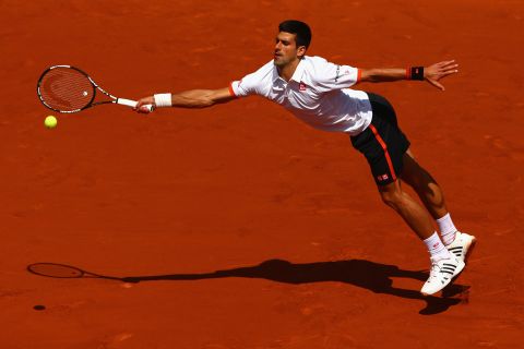 Novak Djokovic at full stretch as he beat Thanasi Kokkinakis of Australia in straight sets in their third round match at Roland Garros. 