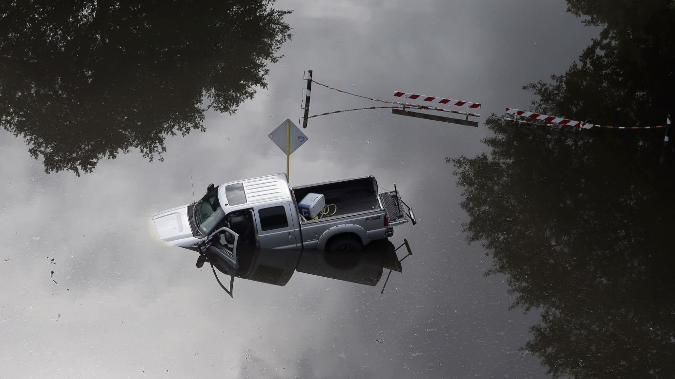 A truck is partially submerged in floodwaters near Houston's Bear Creek Park on May 30.