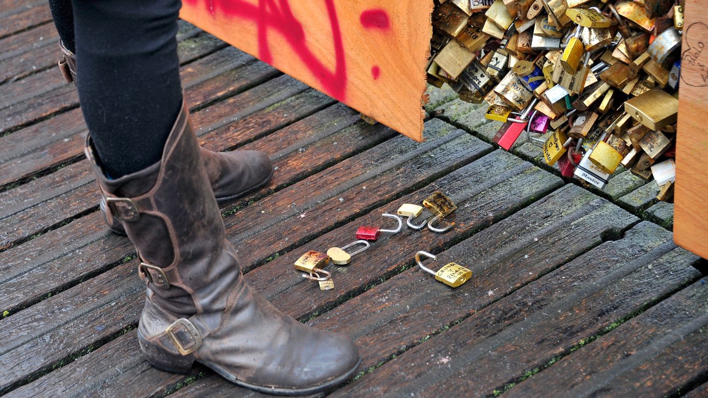 Loose locks sit on the ground near the bridge on February 14.