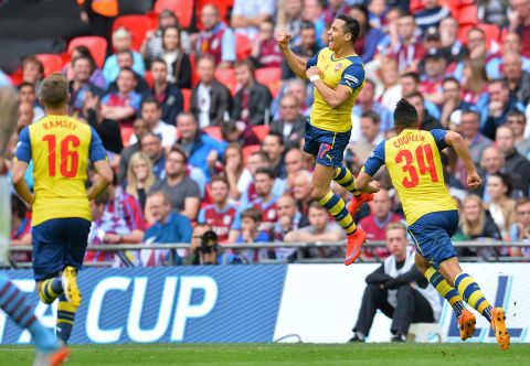 High flyer: Alexis Sanchez goes airborne after scoring a spectacular second goal for Arsenal in the final at Wembley.