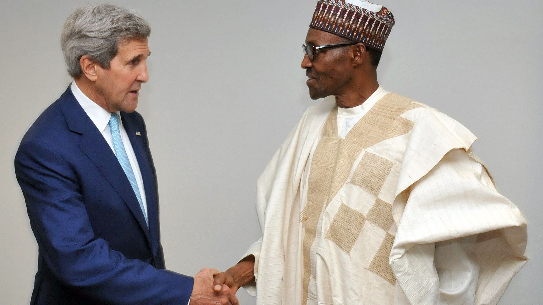 U.S. State Secretary John Kerry shakes hand with Nigerian President Mohammadu Buhari on Wednesday, May 29, shortly after his inauguration in Abuja, Nigeria.