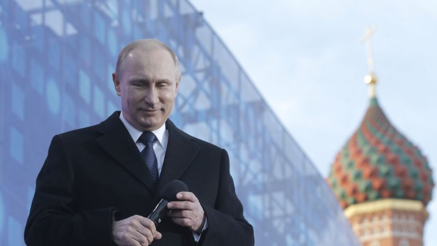 Russia's President Vladimir Putin reacts as he gives a speech during a rally and a concert by the Kremlin Wall in central Moscow on March 18, 2015.