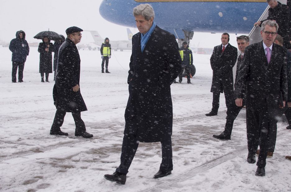 Kerry walks off the plane at Kiev Boryspil International Airport in Kiev, Ukraine, on February 5.  His visit came as international pressure grew for an immediate halt to surging violence.  