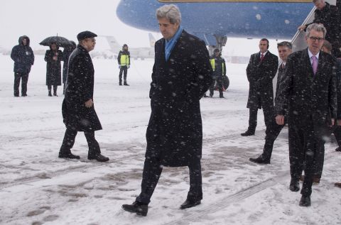Kerry walks off the plane at Kiev Boryspil International Airport in Kiev, Ukraine, on February 5. His visit came as international pressure grew for an immediate halt to surging violence.