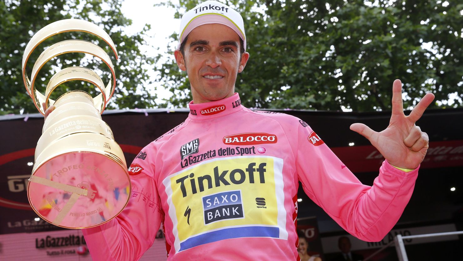 Alberto Contador clutches the winning trophy at the 2015 Giro d'Italia - his second victory in the race.