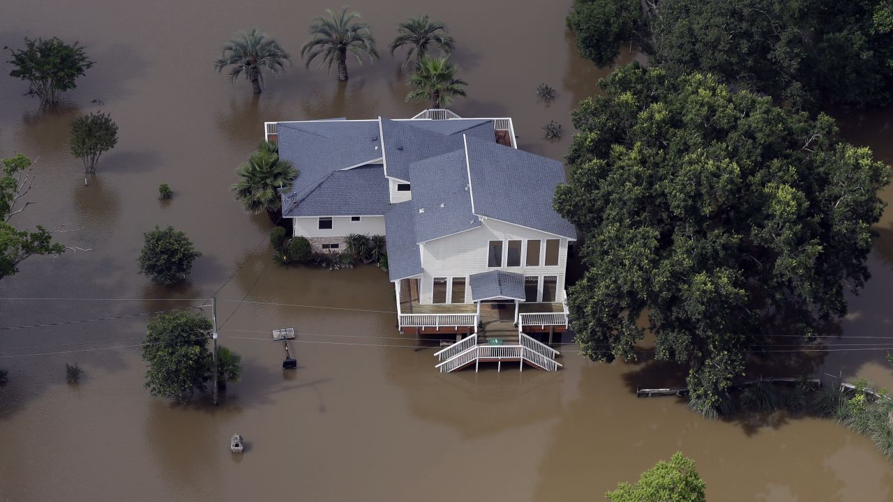 Floodwaters surround a house near the San Jacinto River in Kingwood on May 30.