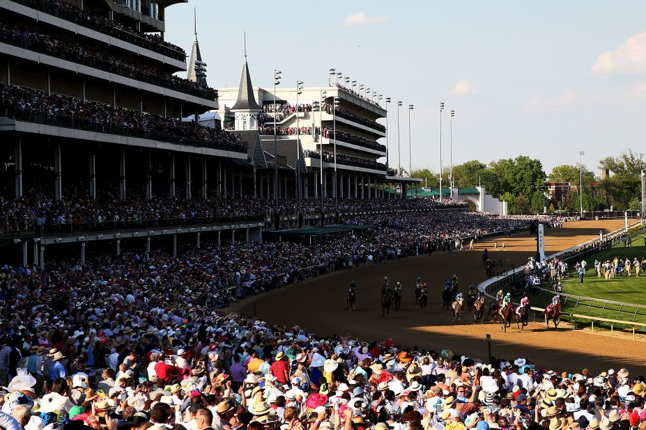 The crowd watches American Pharoah win the Derby and its $1.2 million prize.