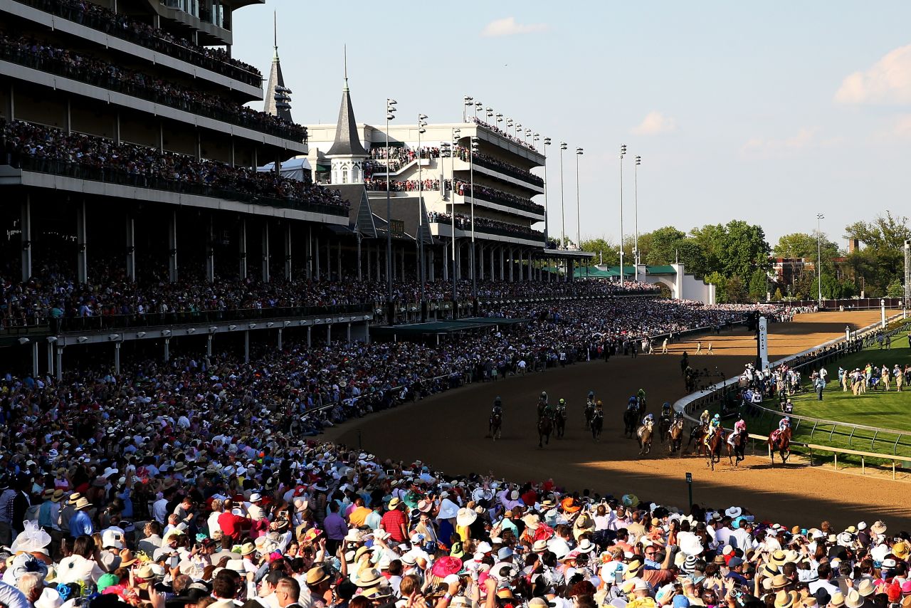 The crowd watches American Pharoah win the Derby and its $1.2 million prize.