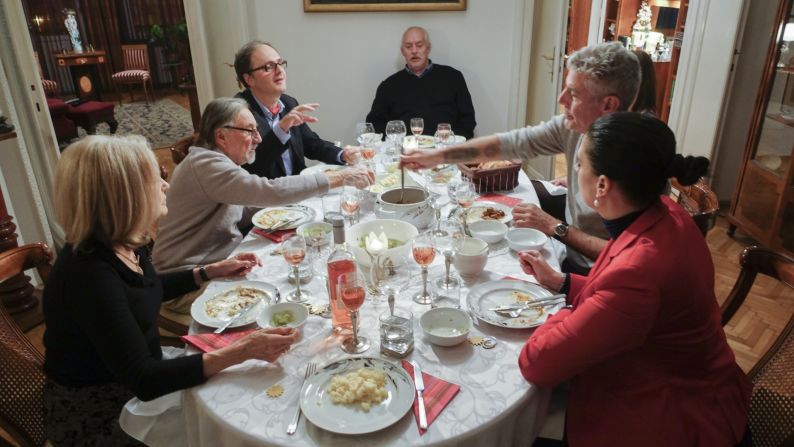 Tony raises a glass over a traditional Hungarian meal.