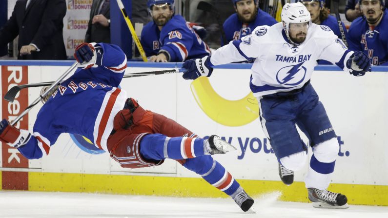 New York Rangers defenseman Dan Boyle falls to the ice after being hit by the stick of Tampa Bay's Alex Killorn during Game 7 of the NHL's Eastern Conference Finals on Friday, May 29. Tampa Bay advanced to the Stanley Cup Final with a 2-0 victory in New York. Killorn had the game's first goal.