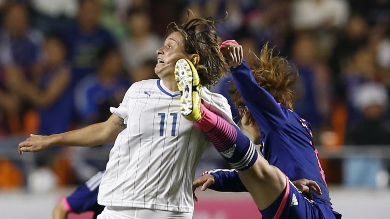 Japan's Mizuho Sakaguchi, right, and Italy's Cristiana Girelli compete for the ball during an international friendly match played Thursday, May 28, in Nagano, Japan. The Women's World Cup begins Saturday, June 6. Japan won the last tournament in 2011.