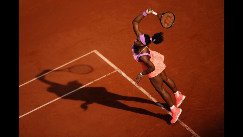Serena Williams serves to Victoria Azarenka in the third round of the French Open on Saturday, May 30. Williams, the world's top-ranked player, advanced to the next round with a three-set victory.