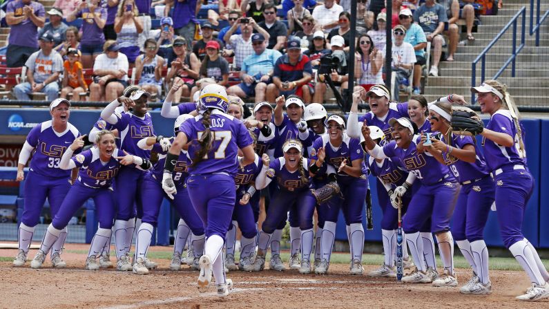 LSU softball player Kellsi Kloss runs to home plate, where her teammates were waiting for her, after a home run in the College World Series on Thursday, May 28. 